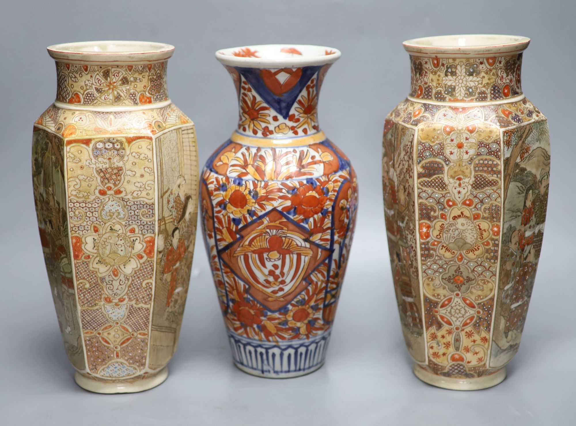 A pair of Japanese Satsuma vases, two others, an Imari vase and a two handled pot, tallest 31cm,